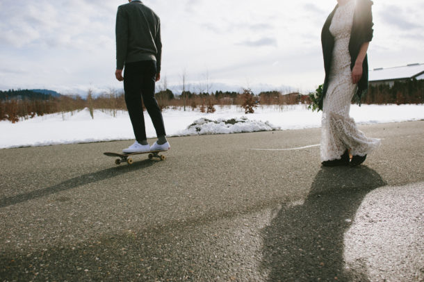 Skateboarding groom at a snowy winter wedding