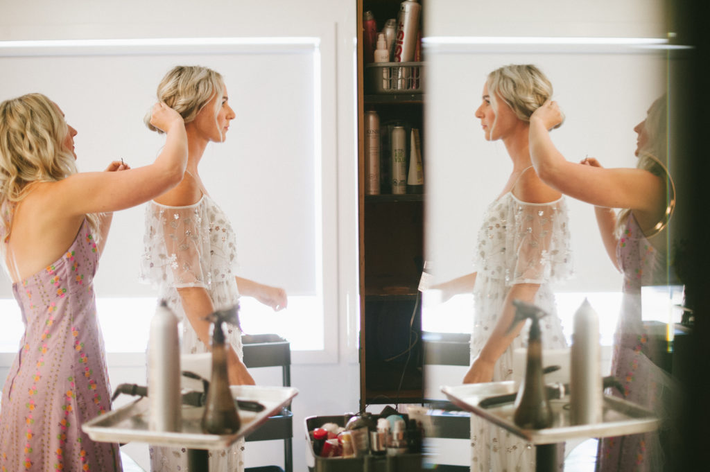 bride getting hair done