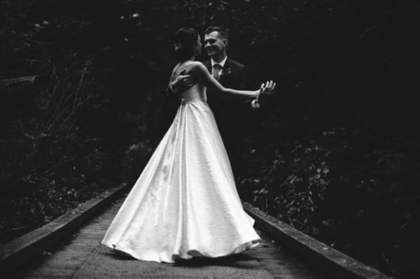 Bride and groom dance in Stanley Park before ceremony at the Loft at Earls Yaletown